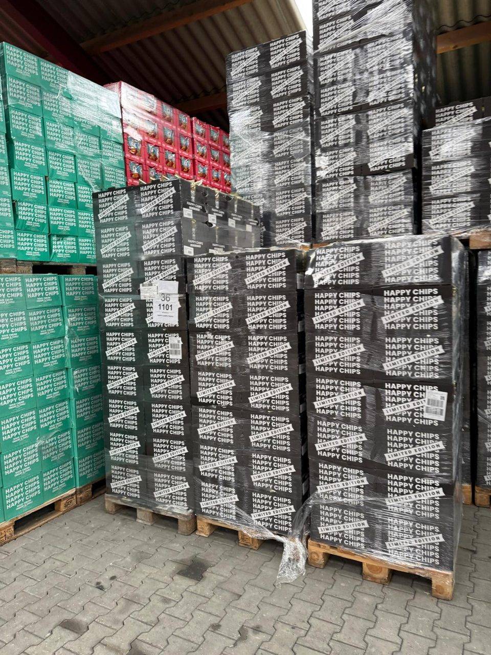 Pallets of limited edition boxes of crisps, wrapped for shipping